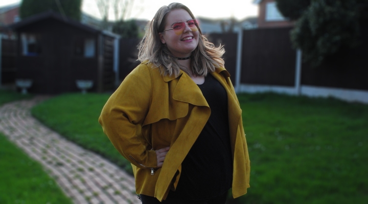 Plus size yellow jacket seen modeled by plus size girl