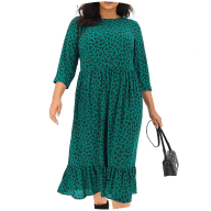 Woman wearing green leopard print smock dress